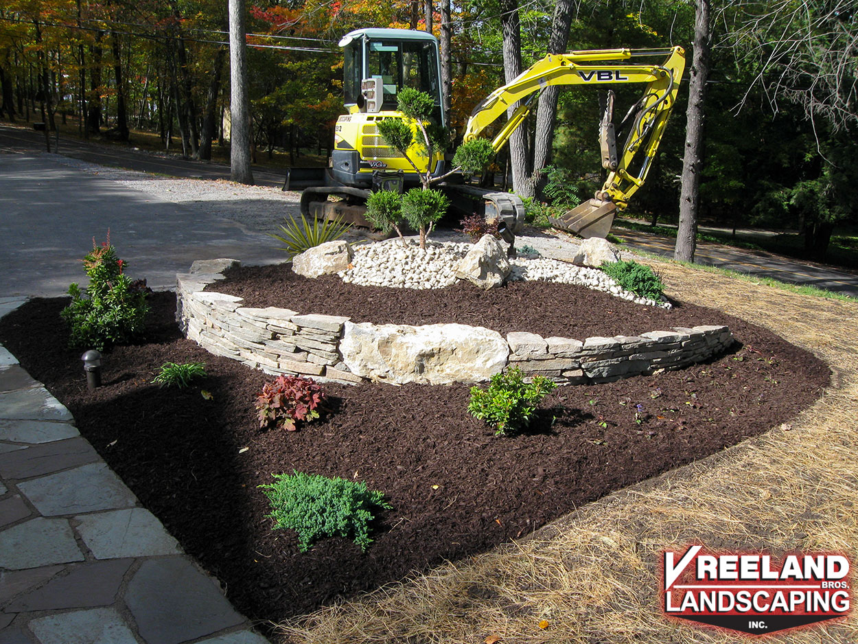 Kinnelon, NJ, Newly installed rock garden, new plantings, and fresh mulch. 