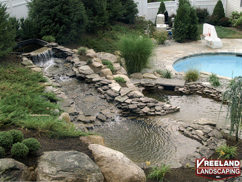 Oak Ridge, NJ, Waterfalls, pond, and landscaping added to existing pool 