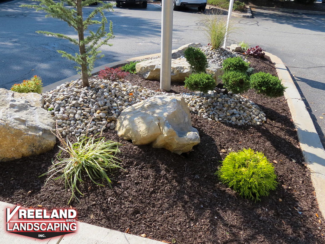 Newton, NJ, Rock garden in commercial parking lot island at a local bank 