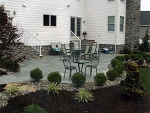 Oak Ridge, NJ - Blue stone masonry patio with plantscape - Vreeland Brothers Landscaping