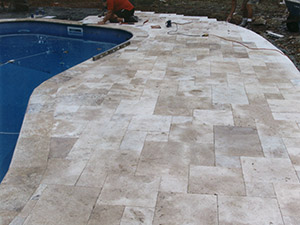 Stockholm, NJ - Custom masonry patio with bullnose coping around pool - Vreeland Brothers Landscaping