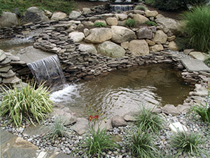 Oak Ridge, NJ - Waterfalls, pond, and landscaping added to existing pool - Vreeland Landscapes