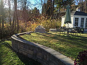 Rockaway, NJ - Decorative block retaining wall and custom built fire pit with grill - Vreeland Landscapes