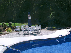 Rockaway, NJ - Existing pool was backfilled; bull nose coping, swirl finish concrete, and a paver patio installed by Vreeland Brothers. - Vreeland Landscapes