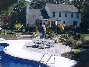 Rockaway, NJ - Existing pool was backfilled; bull nose coping, swirl finish concrete, and a paver patio installed by Vreeland Brothers. - Vreeland Landscapes